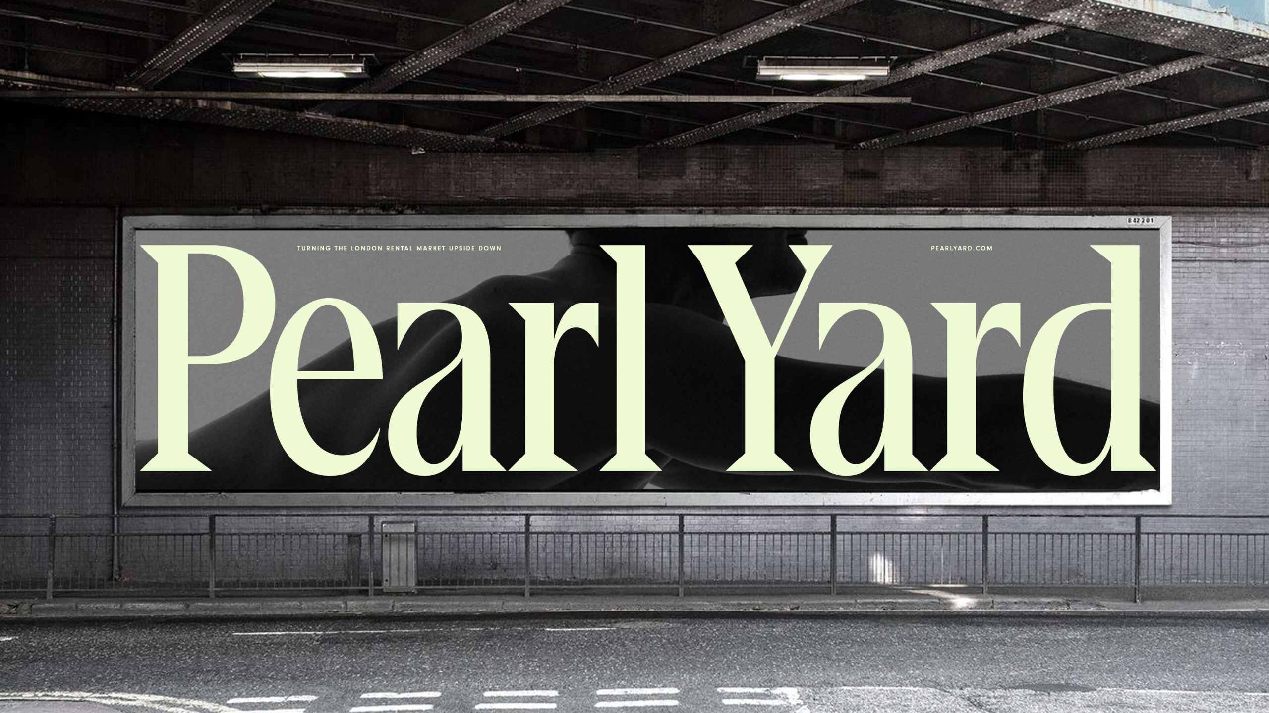 Large-scale billboard displaying the Pearl Yard logo in pale green typography under a bridge