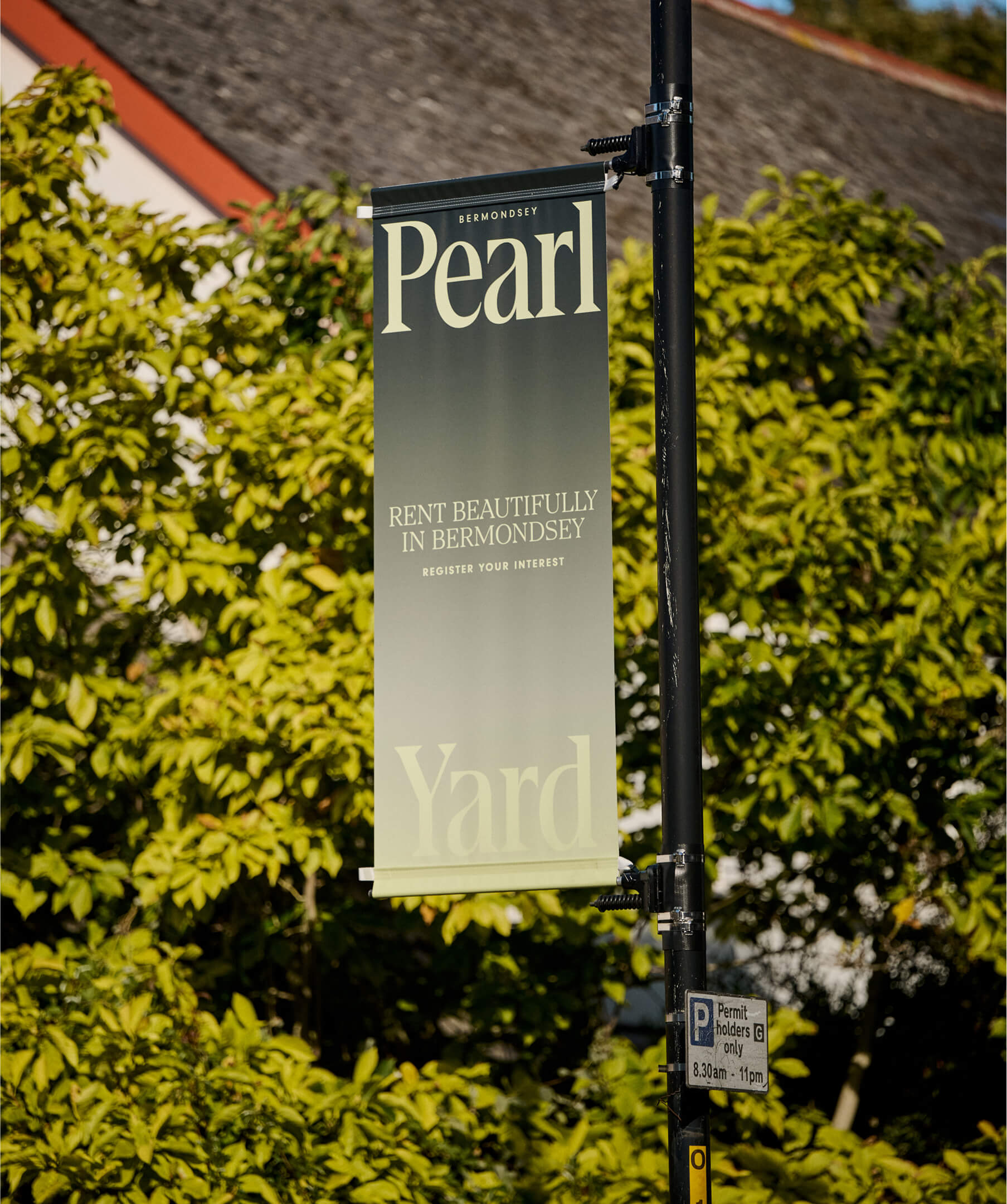 Vertical banner reading ‘Rent Beautifully in Bermondsey’ hanging on a street post