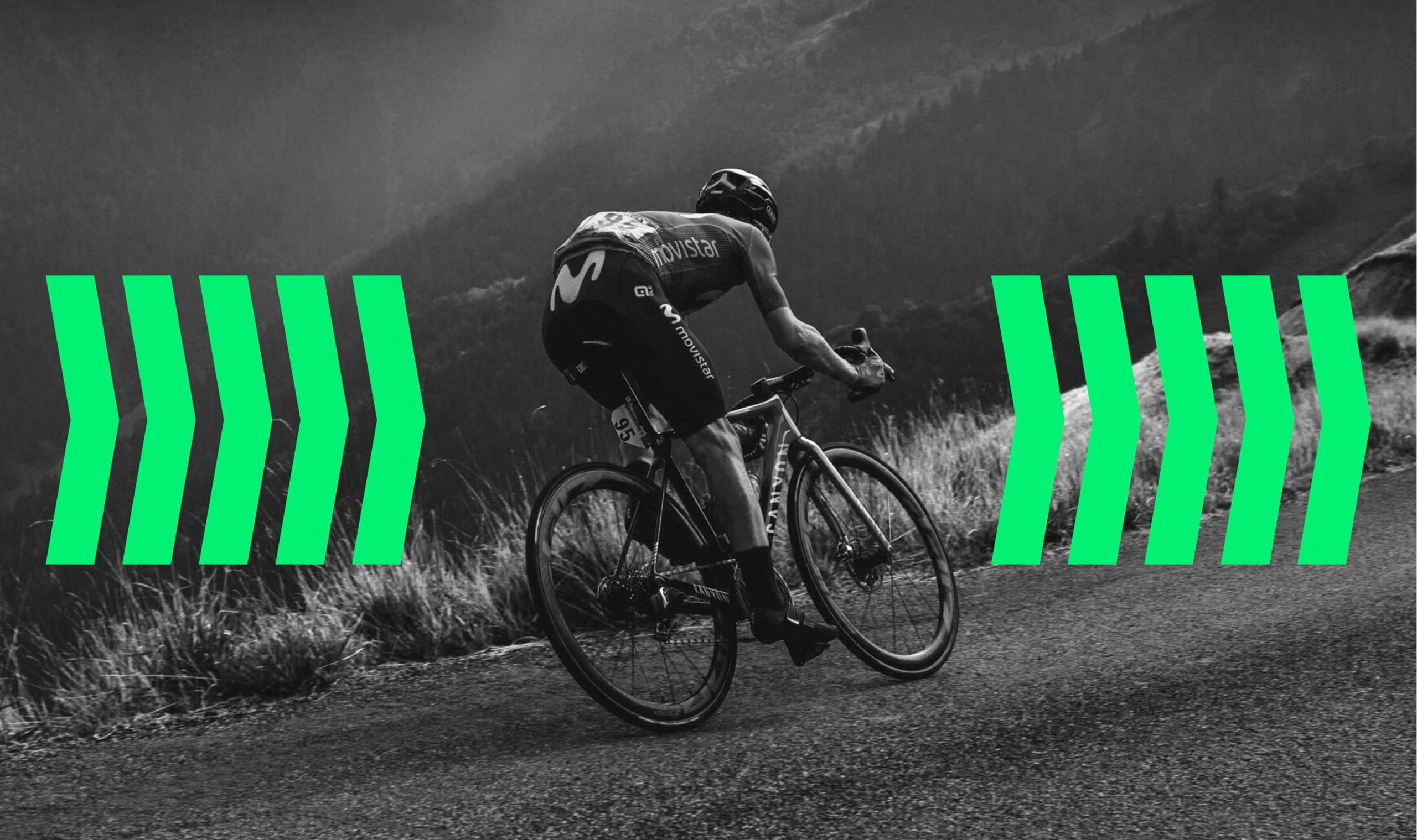 Cyclist riding uphill with green directional arrows representing motion and speed