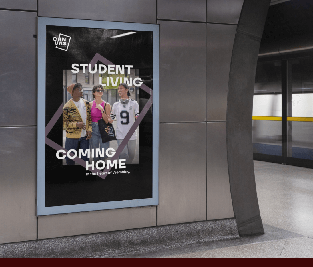 Poster advertising Canvas student living displayed in a London tube station, featuring three students talking and laughing