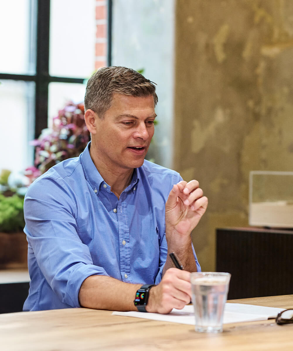 Creative Director speaking during a studio meeting at Mammal